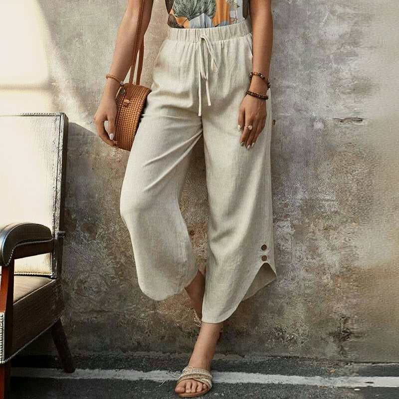 Woman wearing loose blue linen pants.