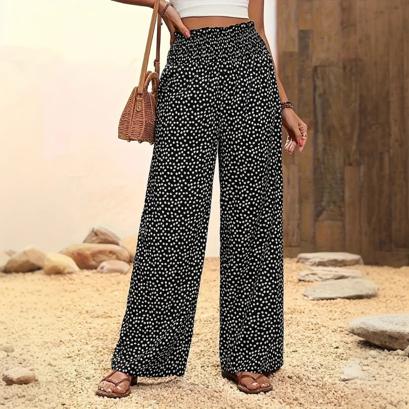 Woman wearing loose blue linen pants.